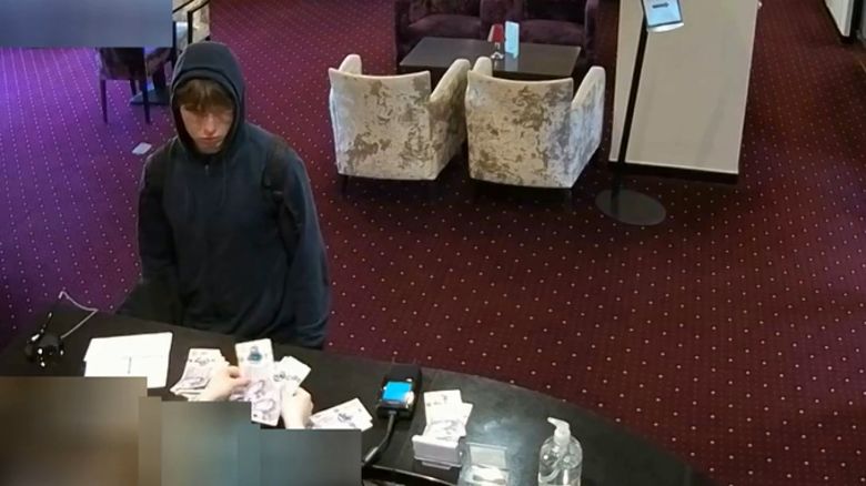 Undated handout file photo issued by London's Metropolitan Police showing Johannes Natland, 19, paying with cash at Briar Court Hotel in Huddersfield, England.