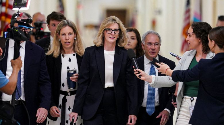 Kathy Ruemmler (center) arrives for an interview before the House Oversight and Government Reform Committee over her ties to convicted sex offender Jeffrey Epstein, on Capitol Hill in Washington, DC, on July 15.