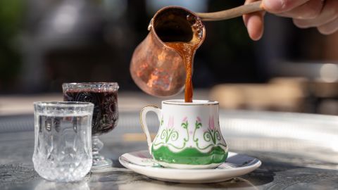 Traditional Turkish coffee, cezve and cup.